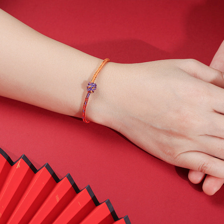 Buddha Stonesの手作りカラフルな紫と金の赤い編みロープブレスレット