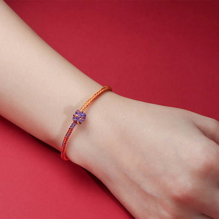 Buddha Stonesの手作りカラフルな紫と金の赤い編みロープブレスレット