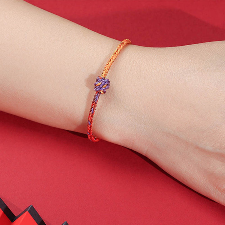 Buddha Stonesの手作りカラフルな紫と金の赤い編みロープブレスレット