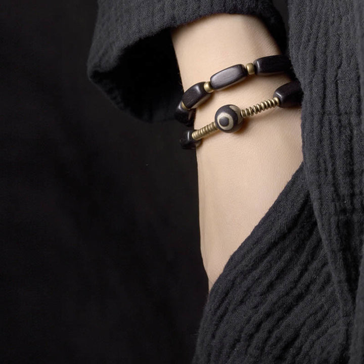 Buddha Stonesチベット 黒檀 木製 Dzi ビーズ 銅製 バランス ダブルラップブレスレット