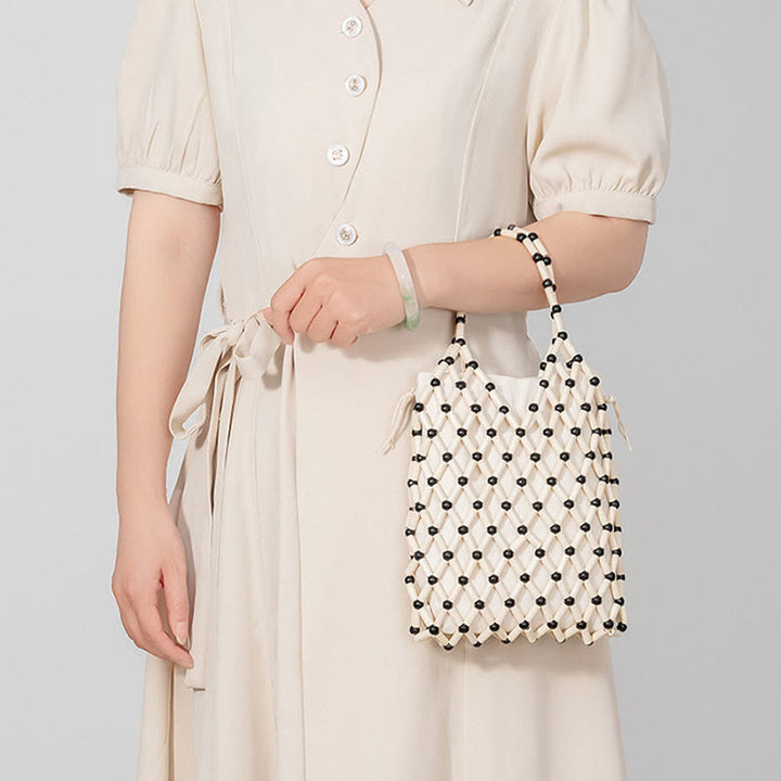 Buddha Stonesの手編みメッシュ中空木製ビーズハンドバッグ