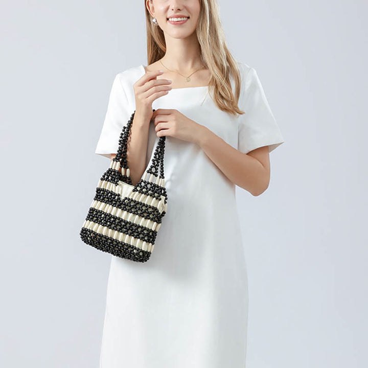 Buddha Stonesの手編み丸型木製ビーズショルダーバッグ