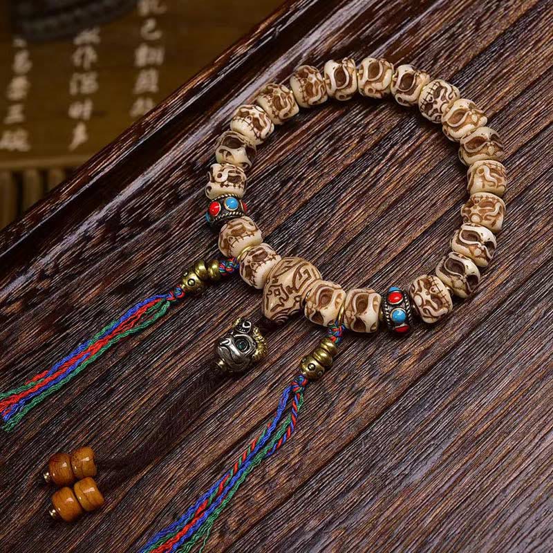 Buddha Stonesチベットラクダ骨ガルーダ彫刻保護タッセルブレスレット