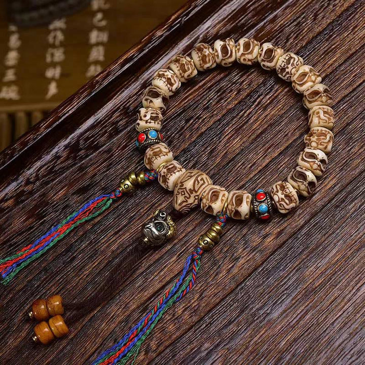Buddha Stonesチベットラクダ骨ガルーダ彫刻保護タッセルブレスレット