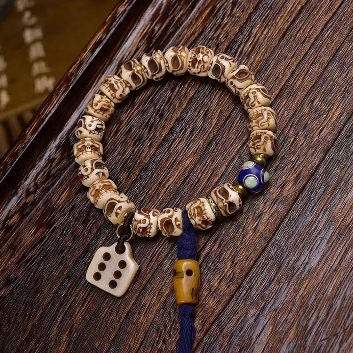 Buddha Stonesチベットラクダ骨ガルーダ彫刻保護タッセルブレスレット
