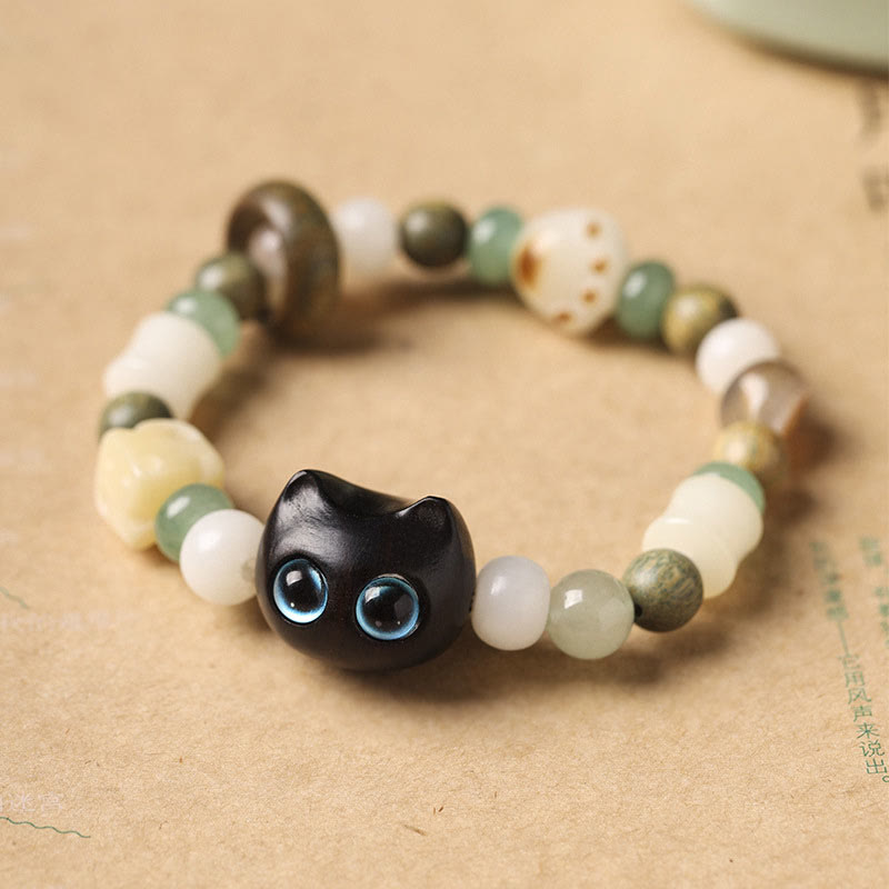 Buddha Stones菩提樹 緑白檀黒檀小葉紫檀猫の頭 足爪 平和ブレスレット - 黒檀の猫(青い目)(手首周り14~16cm) - image 1