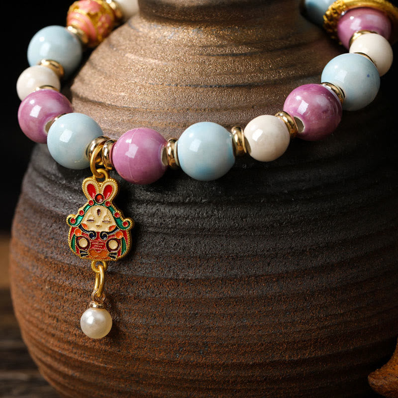 Buddha Stonesチベットのザキラム女神 富の女神 ウサギ ライオンヘッドチャーム リュウリガラスインセンス 灰磁器ビーズ 保護ブレスレット