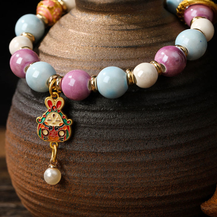 Buddha Stonesチベットのザキラム女神 富の女神 ウサギ ライオンヘッドチャーム リュウリガラスインセンス 灰磁器ビーズ 保護ブレスレット