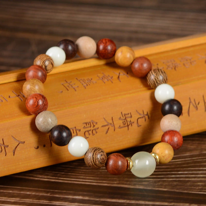 Buddha Stones、多色緑白檀、黒檀、赤白檀の平和ブレスレット