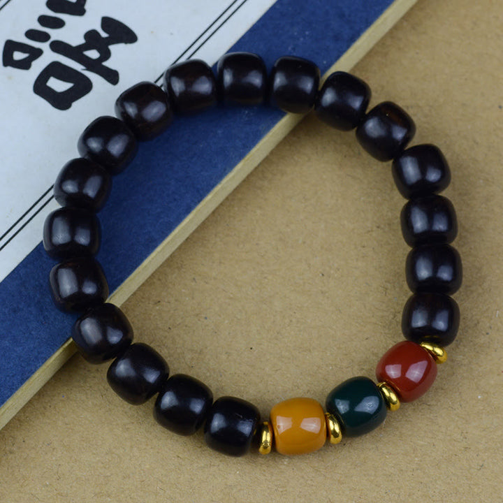 Buddha Stones、多色緑白檀、黒檀、赤白檀の平和ブレスレット