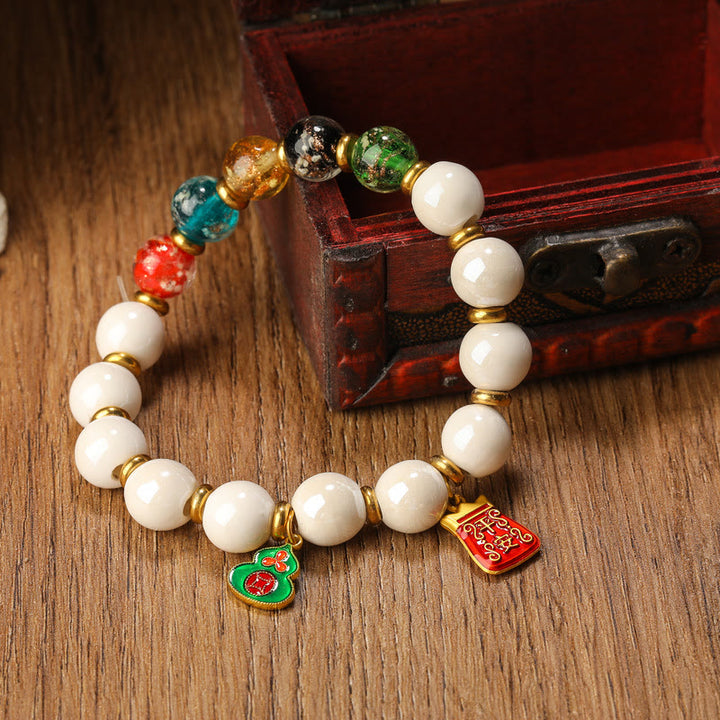 Buddha Stonesチベットのお香 灰磁器 蛍光 リュウリガラスビーズ ひょうたん 銅貨 チャーム 平和ブレスレット