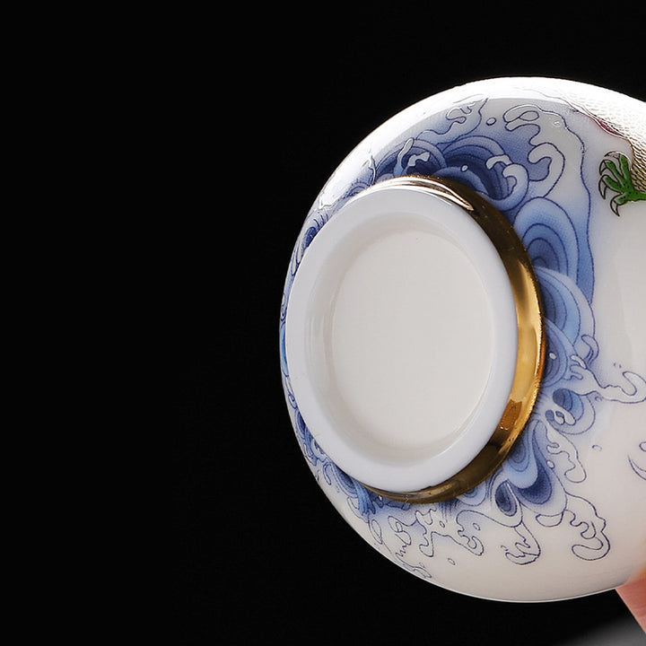 Buddha Stones、龍、鳳凰、吉兆の雲、太陽、海の波、陶器のティーカップ、カンフーティーカップ