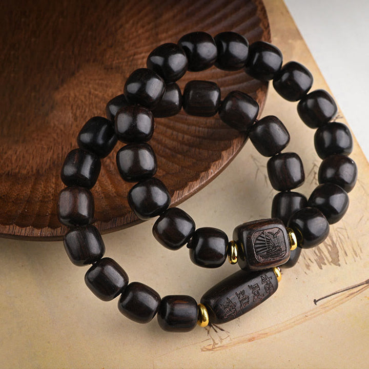 Buddha Stonesチベット黒檀バレルビーズ幸運と宝物バランスブレスレット