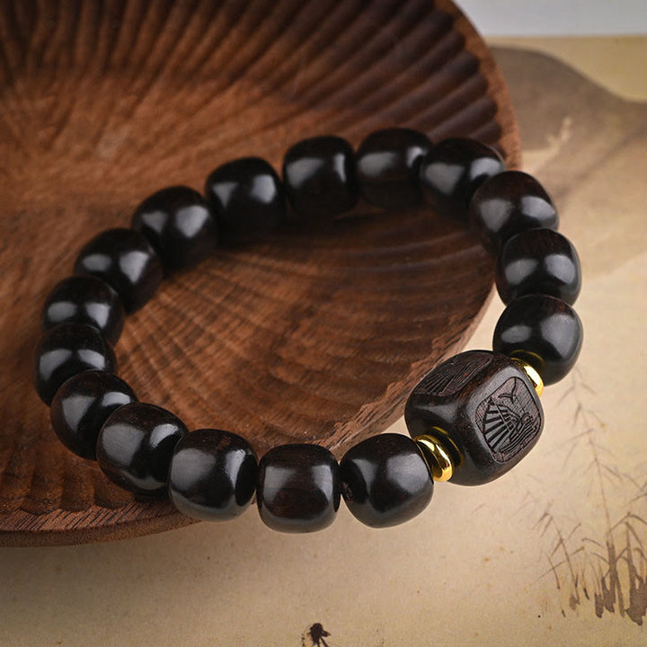 Buddha Stonesチベット黒檀バレルビーズ幸運と宝物バランスブレスレット