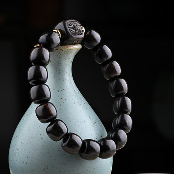 Buddha Stonesチベット黒檀バレルビーズ幸運と宝物バランスブレスレット