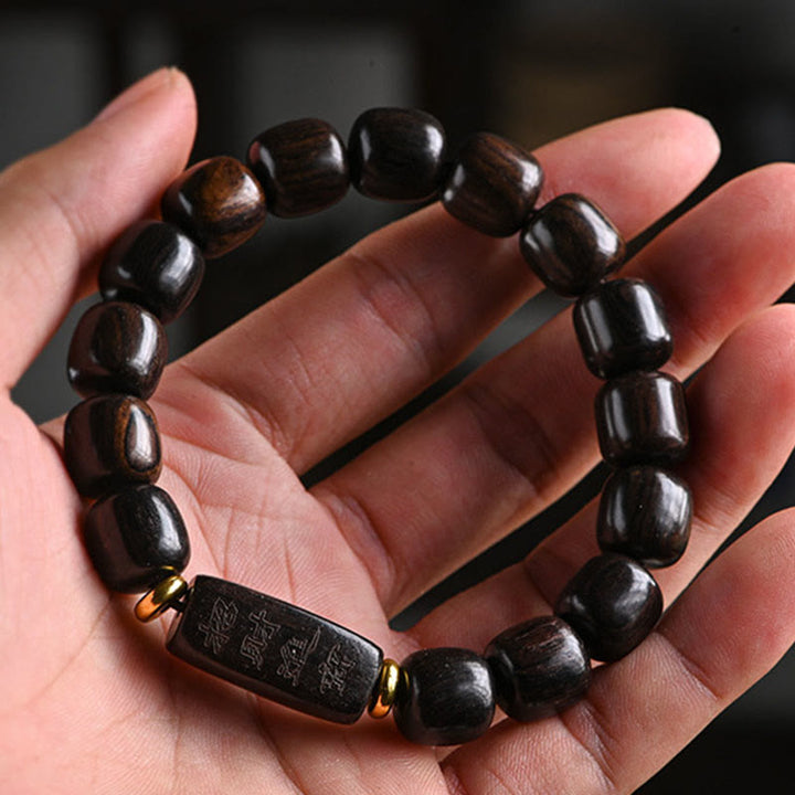 Buddha Stonesチベット黒檀バレルビーズ幸運と宝物バランスブレスレット