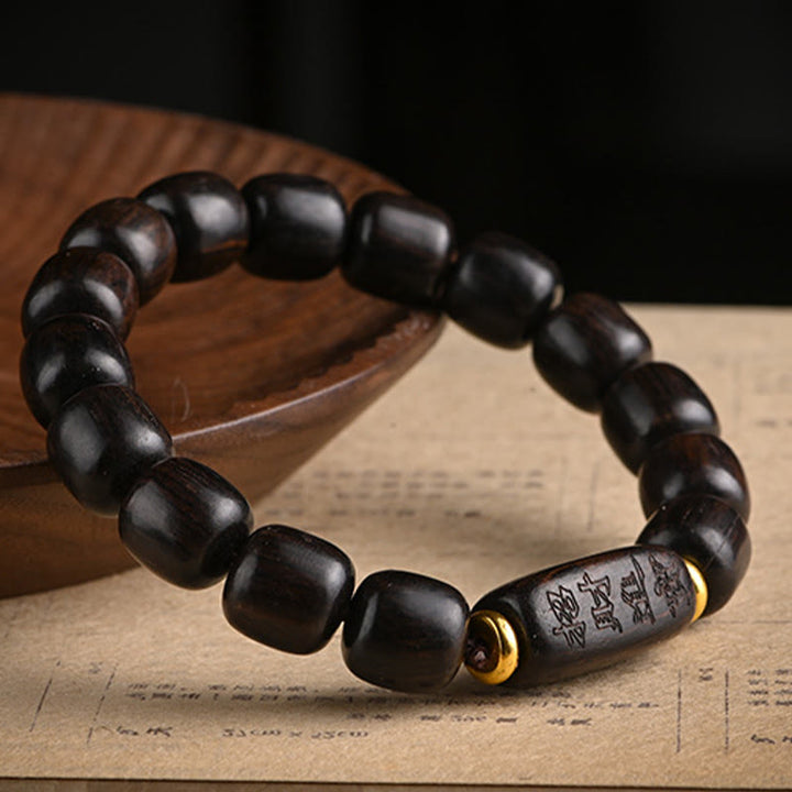 Buddha Stonesチベット黒檀バレルビーズ幸運と宝物バランスブレスレット