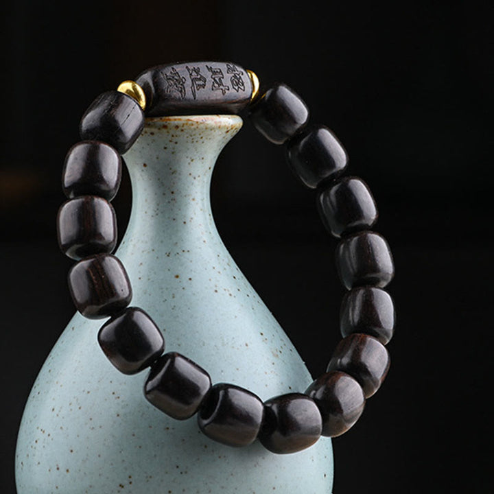 Buddha Stonesチベット黒檀バレルビーズ幸運と宝物バランスブレスレット