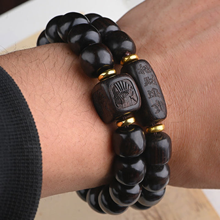 Buddha Stonesチベット黒檀バレルビーズ幸運と宝物バランスブレスレット