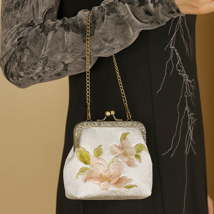 Buddha Stonesと蘭の東洋風桜蝶刺繍のメタルハンドルハンドバッグ