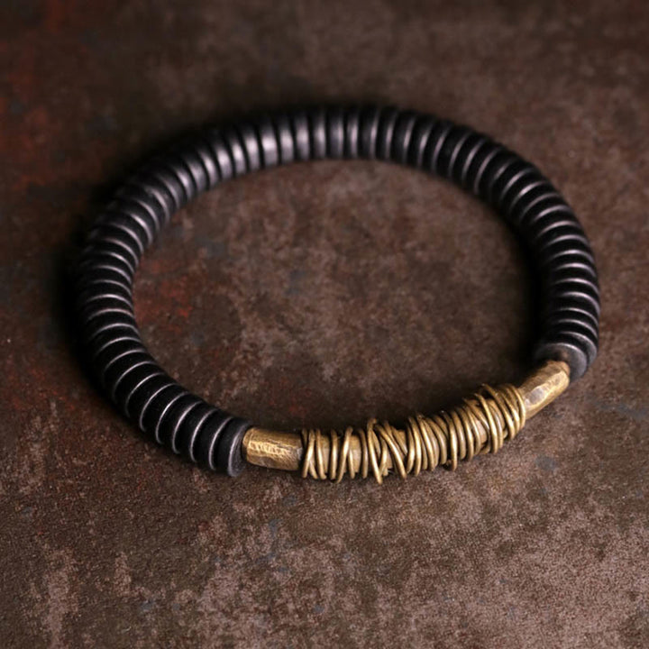 Buddha Stonesの穏やかなチベット黒檀と銅のブレスレット