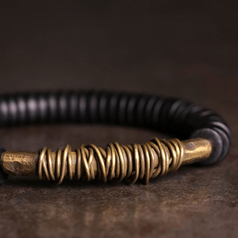 Buddha Stonesの穏やかなチベット黒檀と銅のブレスレット