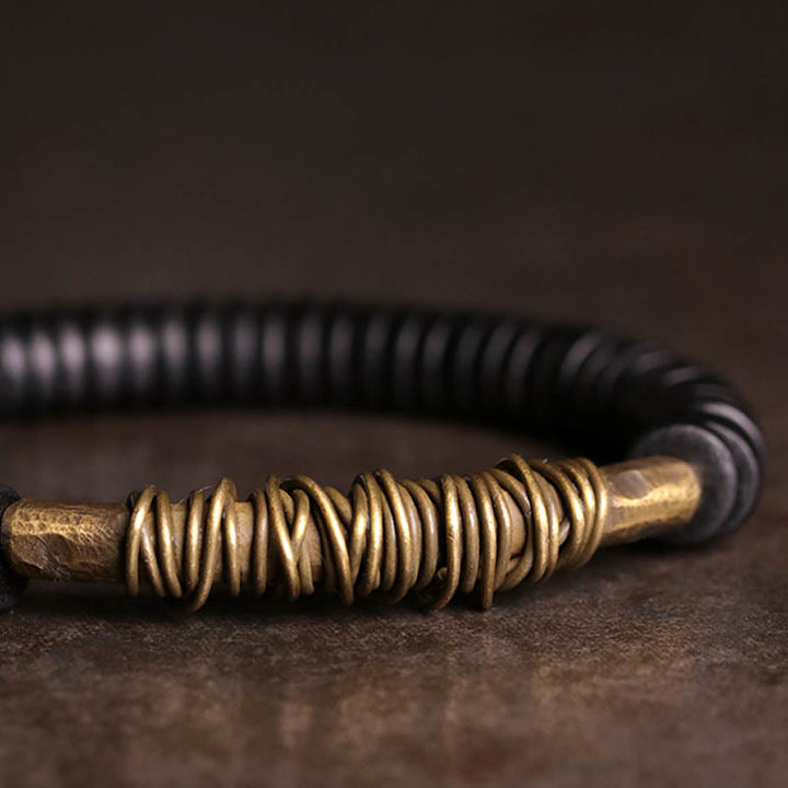 Buddha Stonesの穏やかなチベット黒檀と銅のブレスレット