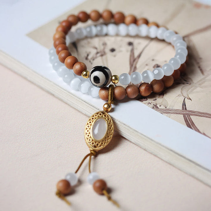 Buddha Stonesサンダルウッドキャッツアイ三眼ビーズクリスタルプロテクションブレスレット