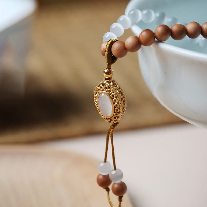 Buddha Stonesサンダルウッドキャッツアイ三眼ビーズクリスタルプロテクションブレスレット