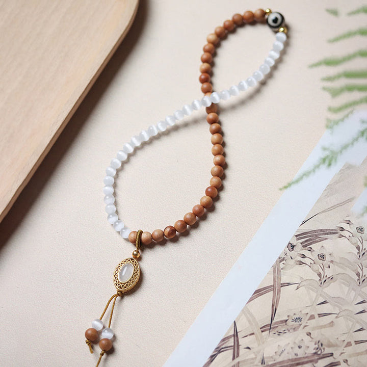 Buddha Stonesサンダルウッドキャッツアイ三眼ビーズクリスタルプロテクションブレスレット