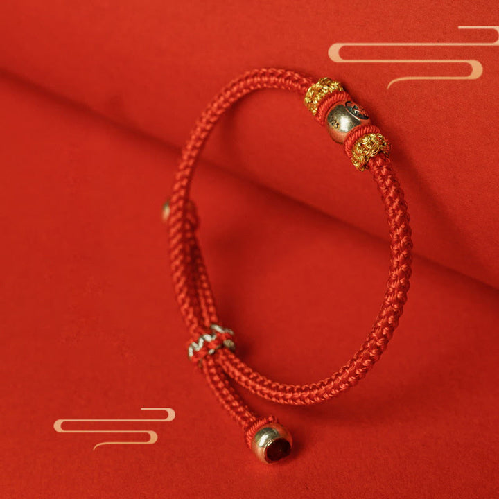 Buddha Stonesの赤い糸の漢字の守護ブレスレット