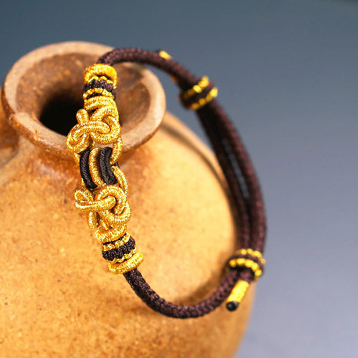Buddha Stonesの赤い紐のサドルノットの強さのブレスレット