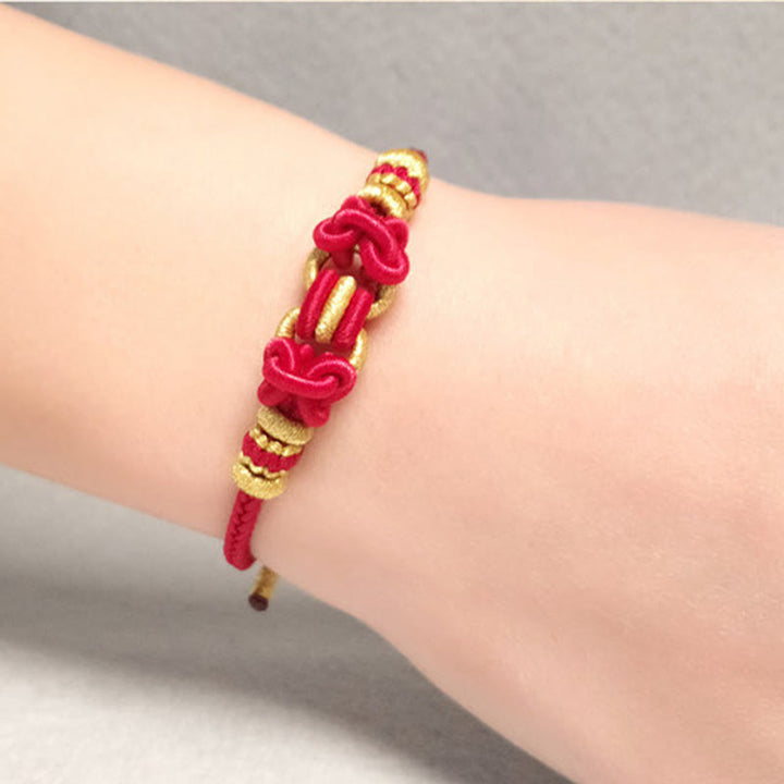 Buddha Stonesの赤い紐のサドルノットの強さのブレスレット