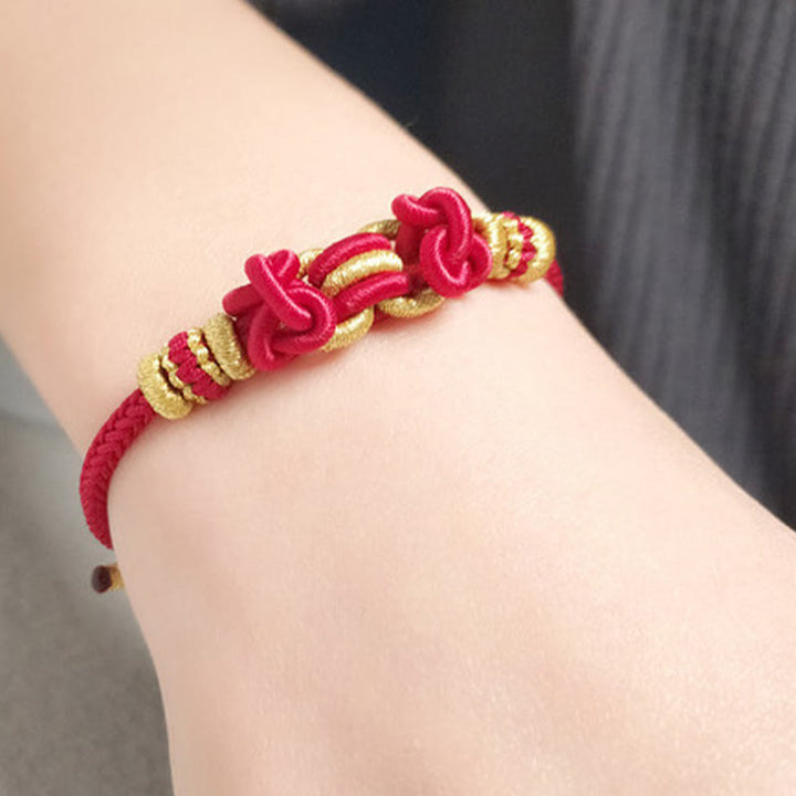 Buddha Stonesの赤い紐のサドルノットの強さのブレスレット