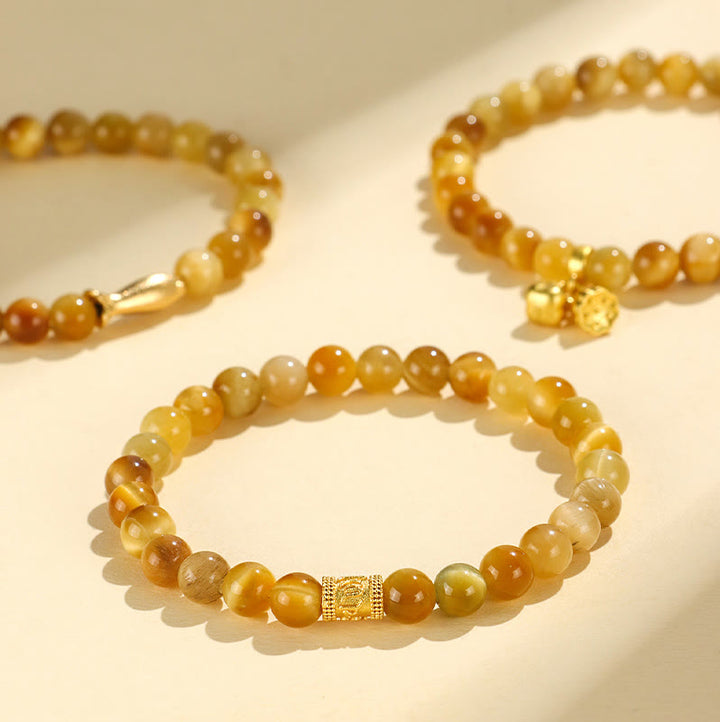 Buddha Stonesタイガーアイフーキャラクター竹鯉魚ロータスオーム・マニ・パドメ・フム守護ブレスレット