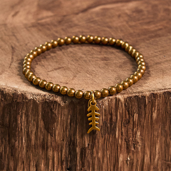 Buddha Stones、真鍮、銅、魚の骨を使ったヒーリングブレスレット - image 9