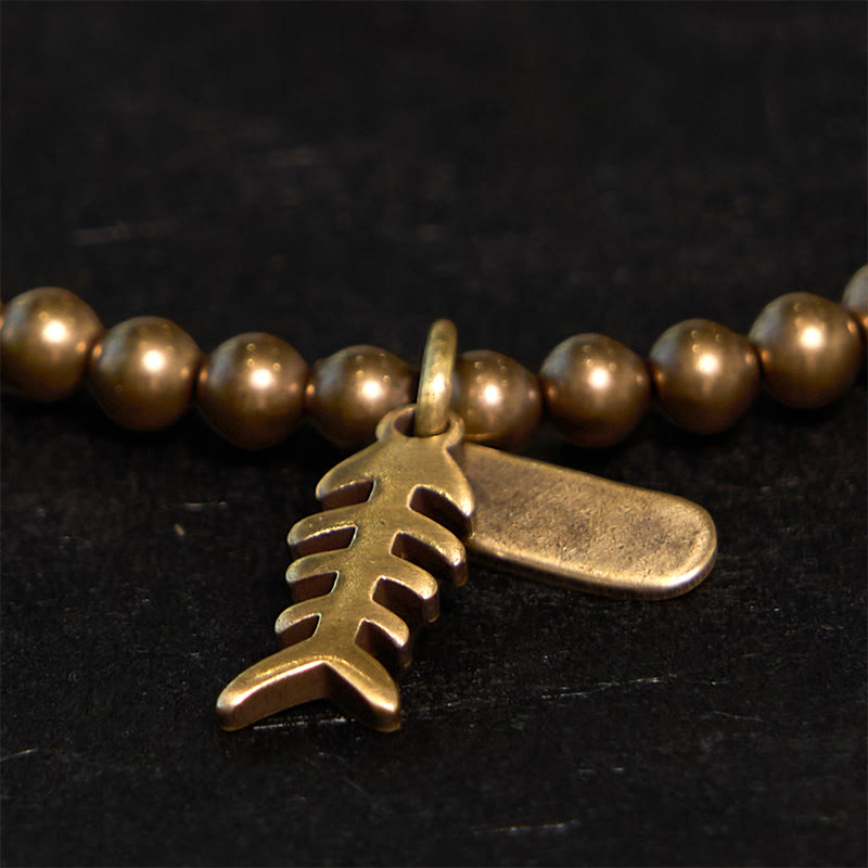 Buddha Stones、真鍮、銅、魚の骨を使ったヒーリングブレスレット - image 2