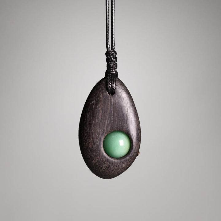 Buddha Stones、黒檀、グリーンアベンチュリン、平和の穏やかなネックレスペンダント