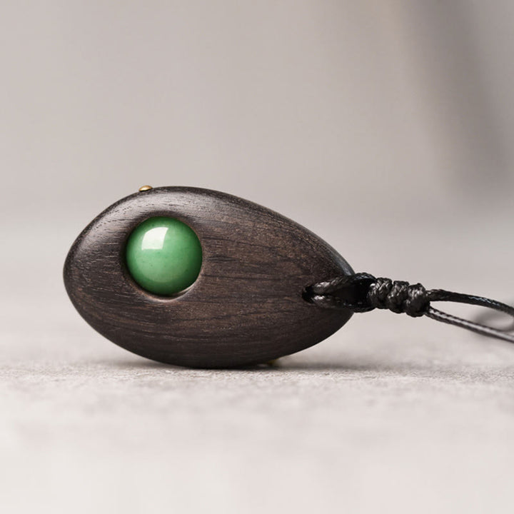 Buddha Stones、黒檀、グリーンアベンチュリン、平和の穏やかなネックレスペンダント