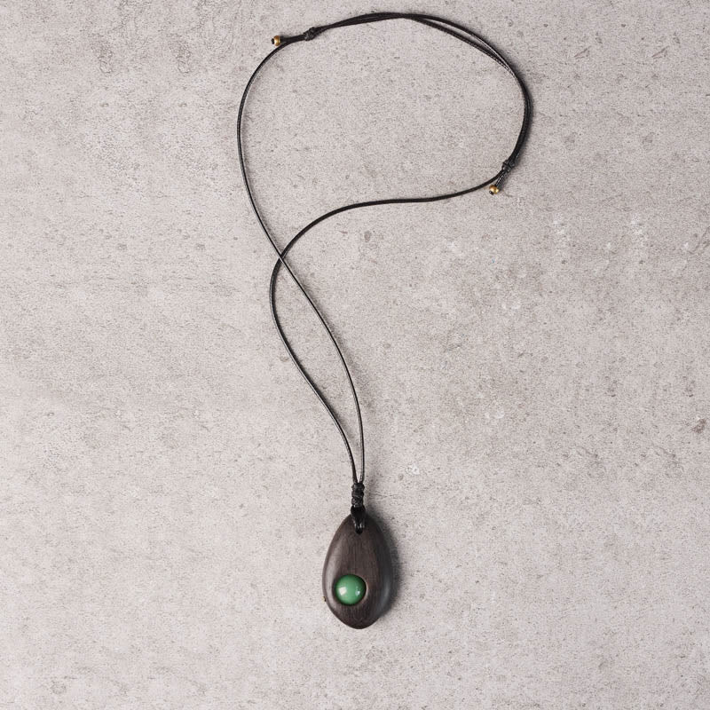 Buddha Stones、黒檀、グリーンアベンチュリン、平和の穏やかなネックレスペンダント