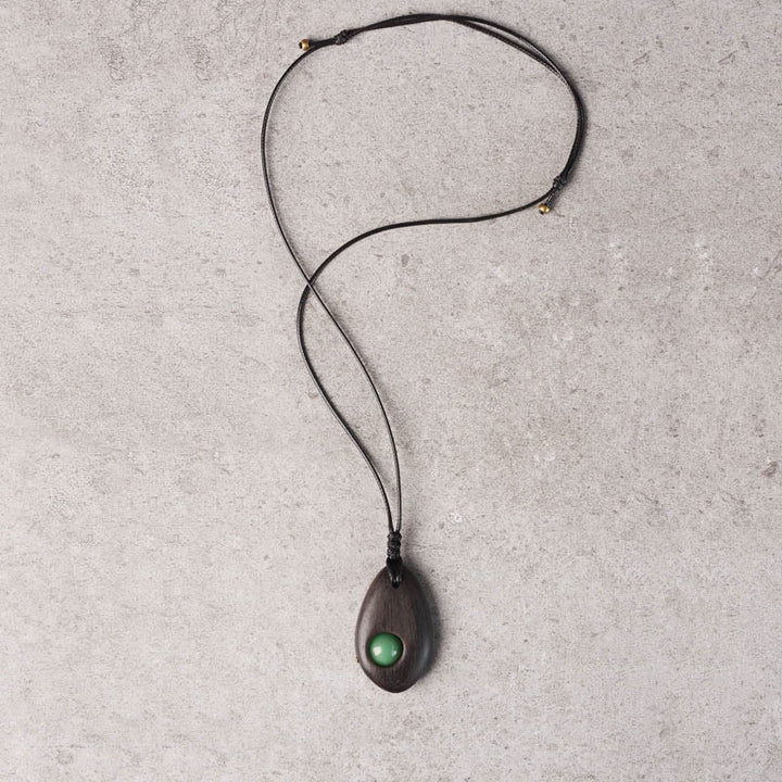 Buddha Stones、黒檀、グリーンアベンチュリン、平和の穏やかなネックレスペンダント