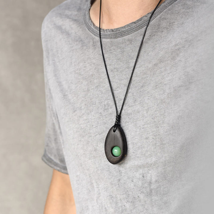 Buddha Stones、黒檀、グリーンアベンチュリン、平和の穏やかなネックレスペンダント