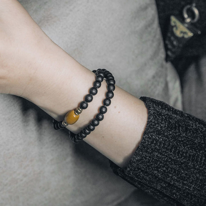 Buddha Stonesつや消しカット面 ブラックオニキス トパーズビーズ ダブルラップ保護ブレスレット