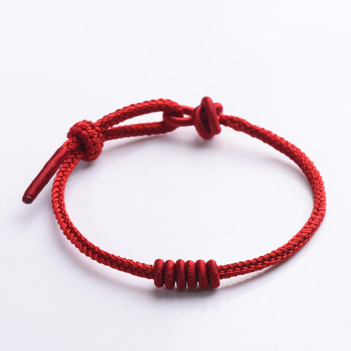 Buddha Stonesの赤い糸の8本撚りロープの強さのブレスレット