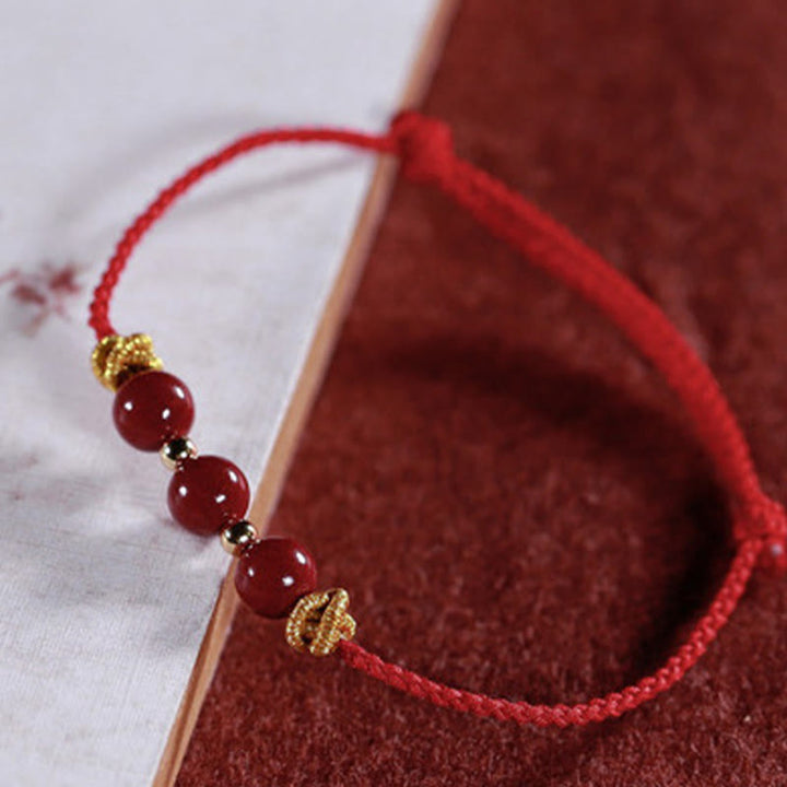 Buddha Stonesのカラフルな紐、辰砂の落ち着いたブレスレット