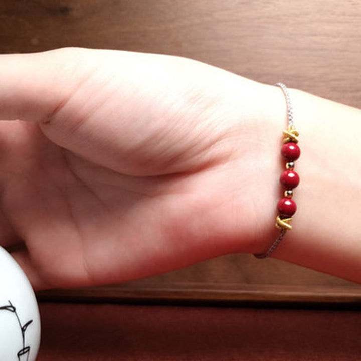 Buddha Stonesのカラフルな紐、辰砂の落ち着いたブレスレット
