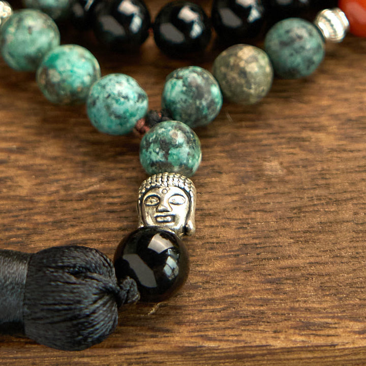 Buddha Stones 108Mala天然ブラックオニキス レッドジャスパー ターコイズビーズ 仏陀の頭 タッセル 保護ブレスレット