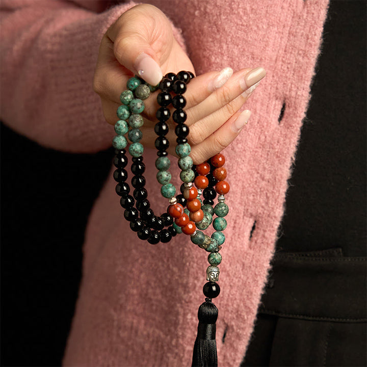 Buddha Stones 108Mala天然ブラックオニキス レッドジャスパー ターコイズビーズ 仏陀の頭 タッセル 保護ブレスレット