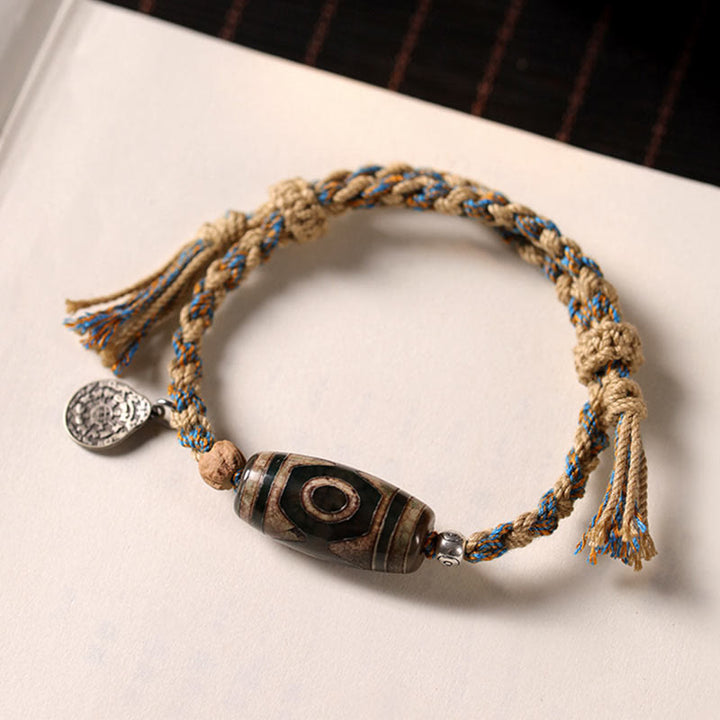 Buddha StonesチベットのDziビーズ富の守護編みブレスレット