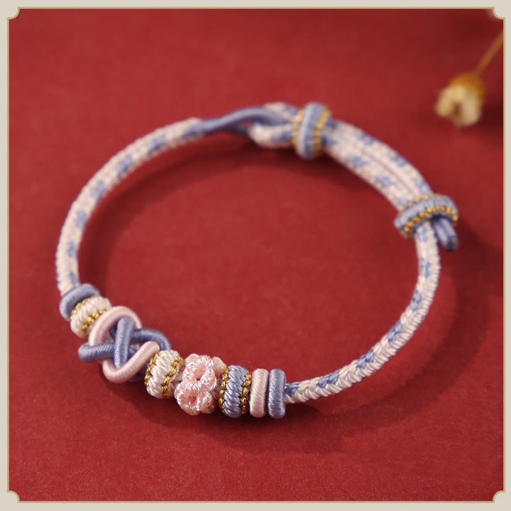 Buddha Stones手作りの桃の花の平和結び目カラフルなロープ調節可能なブレスレット
